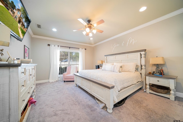 carpeted bedroom featuring ceiling fan and ornamental molding