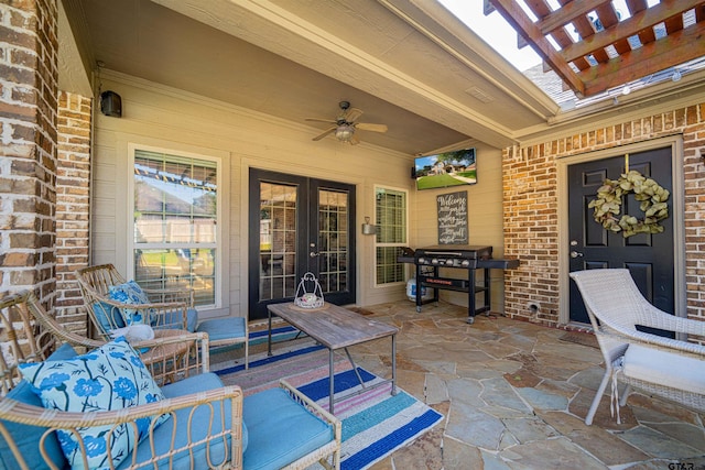 view of patio featuring area for grilling and ceiling fan