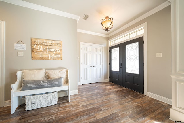 foyer entrance featuring french doors, dark hardwood / wood-style flooring, and ornamental molding