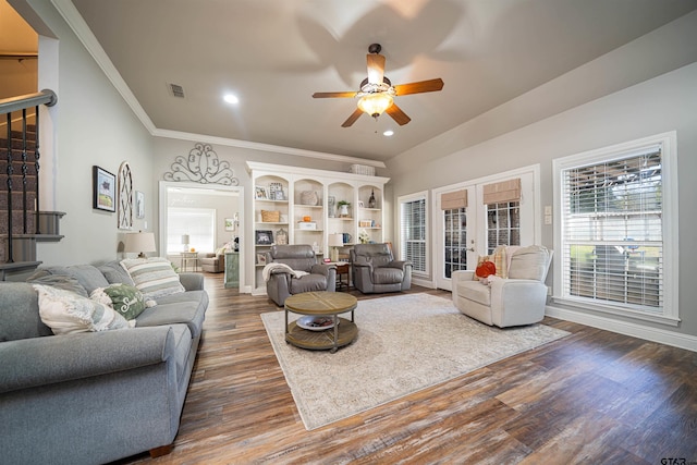 living room featuring ceiling fan, french doors, crown molding, and dark hardwood / wood-style floors