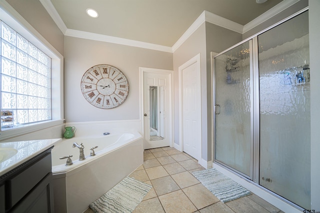 bathroom with tile patterned flooring, vanity, separate shower and tub, and ornamental molding