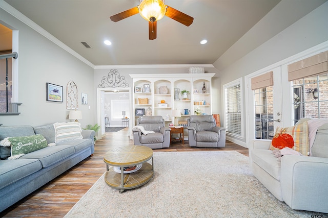 living room with wood-type flooring, french doors, ceiling fan, and crown molding