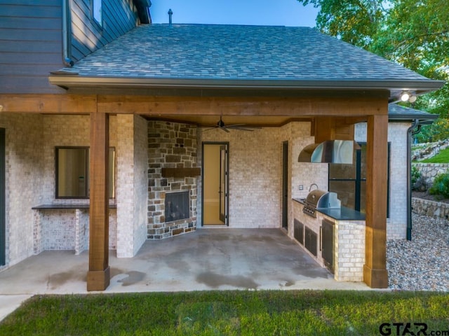 view of patio / terrace with an outdoor kitchen and area for grilling