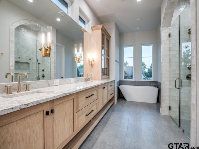 bathroom with vanity, shower with separate bathtub, and tile patterned floors