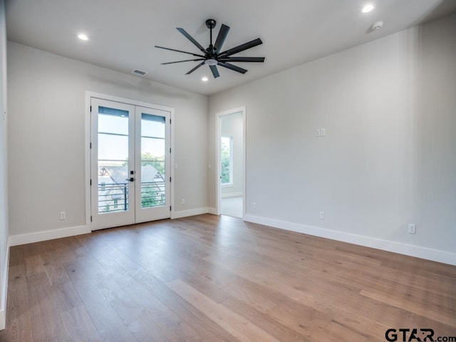 2424 Bellview Cir, Tyler, TX 75709 - empty room featuring french doors, light wood-style floors, a ceiling fan, recessed lighting, and a smoke detector