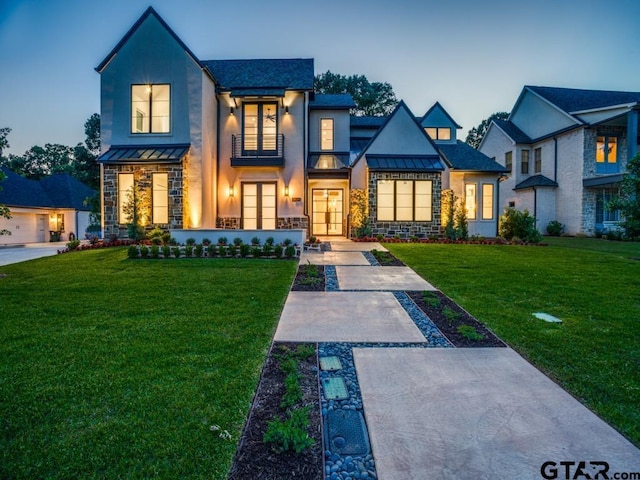 2424 Bellview Cir, Tyler, TX 75709 - view of front of property with a standing seam roof, stucco siding, and a metal roof
