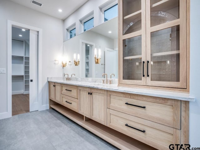 bathroom with vanity and wood-type flooring