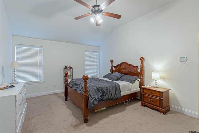 carpeted bedroom with vaulted ceiling and ceiling fan