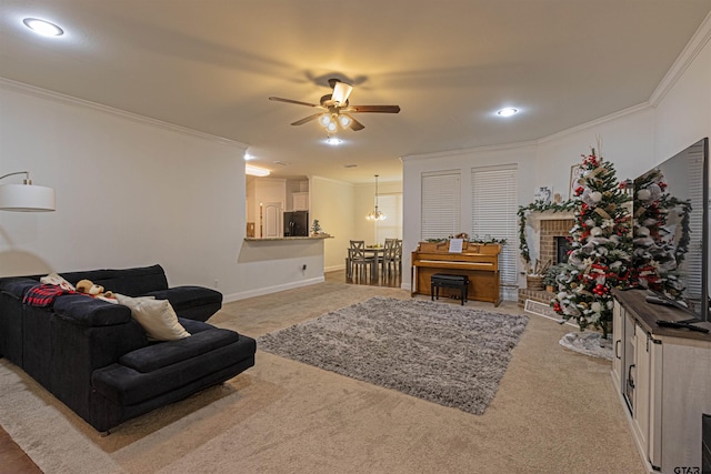 living room featuring carpet flooring, ceiling fan with notable chandelier, and ornamental molding