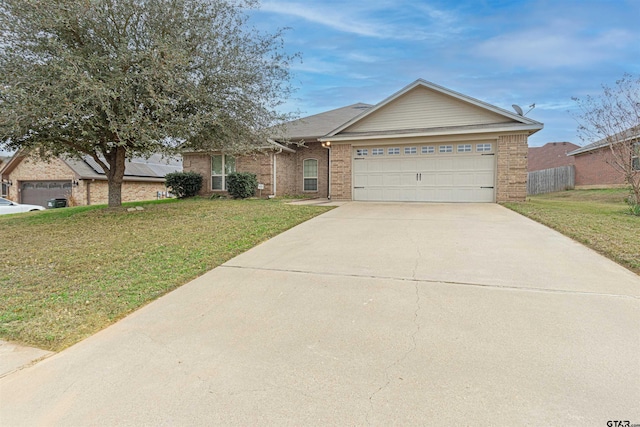 ranch-style home featuring a garage and a front lawn