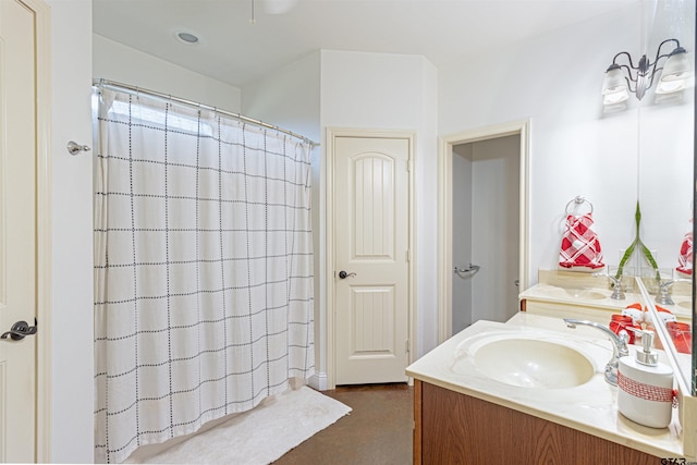 bathroom featuring a shower with curtain and vanity