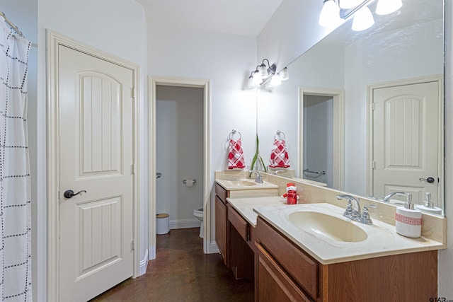 bathroom featuring vanity and toilet