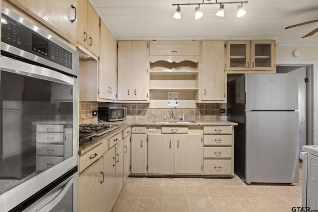 302 Smith St, Naples, TX 75568 - kitchen with appliances with stainless steel finishes, a sink, tasteful backsplash, open shelves, and light stone countertops
