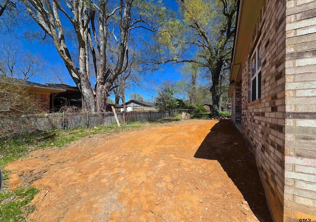 view of yard featuring fence