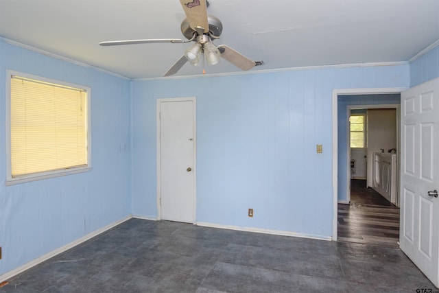 unfurnished room with ceiling fan and crown molding