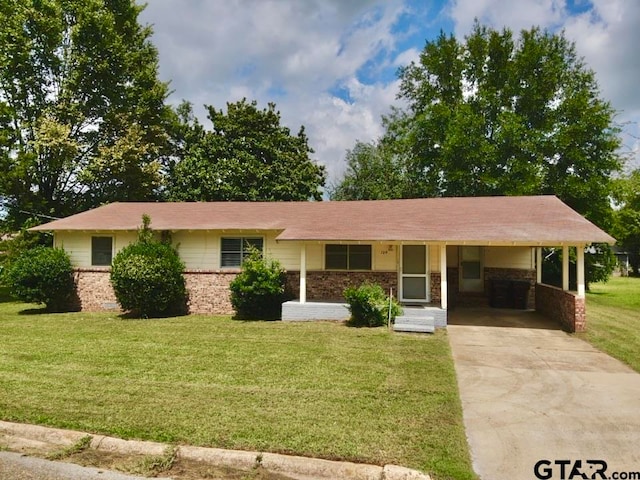 single story home with a front yard and a carport