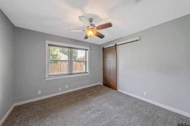 106 Forest S Dr, Whitehouse, TX 75791 - unfurnished bedroom featuring carpet flooring, a barn door, and baseboards