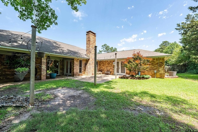 106 Forest S Dr, Whitehouse, TX 75791 - rear view of house featuring french doors, a patio, a chimney, and brick siding