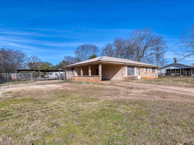 exterior space with a front yard and a carport