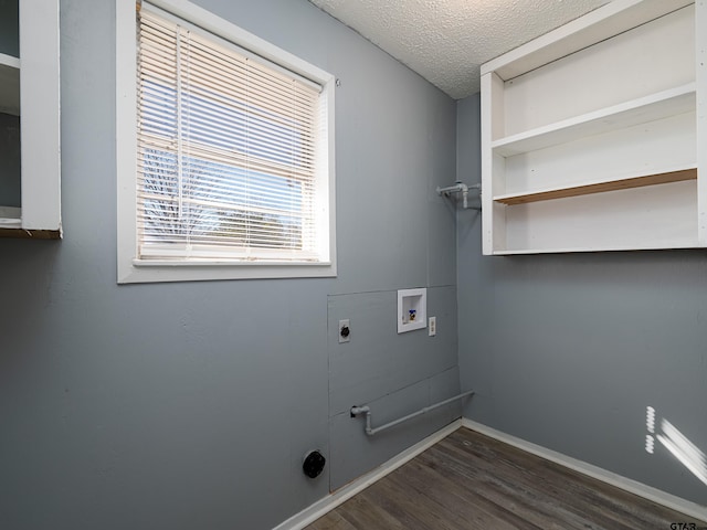 washroom with washer hookup, a textured ceiling, dark hardwood / wood-style flooring, and electric dryer hookup