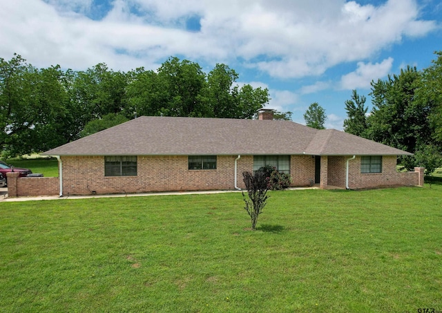 ranch-style home featuring a front yard