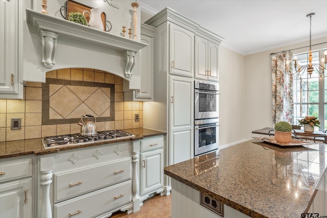 523 Southcreek Dr, Chandler, TX 75758 - kitchen with stainless steel appliances, a chandelier, tasteful backsplash, dark stone counters, and decorative light fixtures