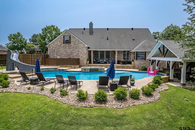 523 Southcreek Dr, Chandler, TX 75758 - view of swimming pool with a water slide, a gazebo, a patio, and a pool with connected hot tub