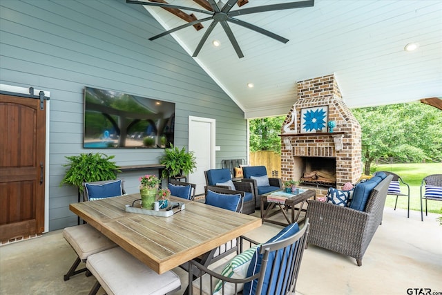 523 Southcreek Dr, Chandler, TX 75758 - view of patio / terrace with ceiling fan and an outdoor living space with a fireplace