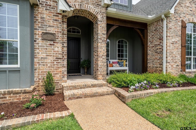 523 Southcreek Dr, Chandler, TX 75758 - entrance to property with brick siding, a shingled roof, and covered porch