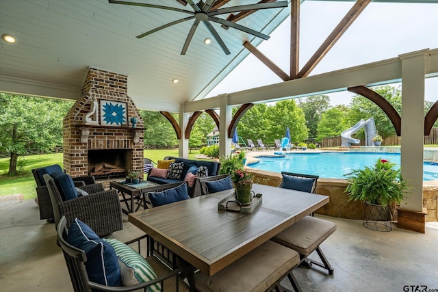 523 Southcreek Dr, Chandler, TX 75758 - view of patio / terrace featuring a ceiling fan and an outdoor living space with a fireplace