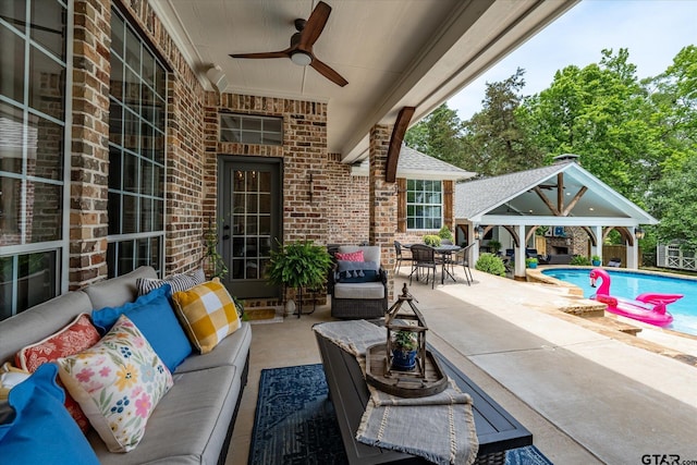 523 Southcreek Dr, Chandler, TX 75758 - view of patio featuring outdoor lounge area, ceiling fan, a gazebo, an outdoor pool, and outdoor dining space