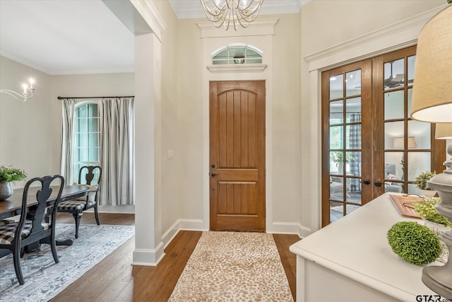 523 Southcreek Dr, Chandler, TX 75758 - foyer entrance featuring french doors, a chandelier, plenty of natural light, dark wood-type flooring, and crown molding