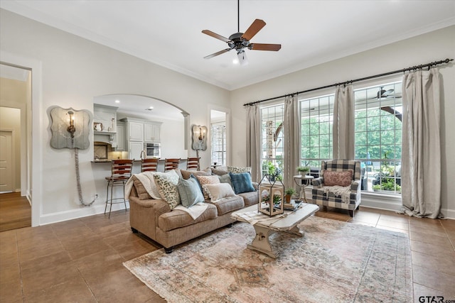 523 Southcreek Dr, Chandler, TX 75758 - tiled living area featuring a ceiling fan, ornamental molding, arched walkways, baseboards, and recessed lighting