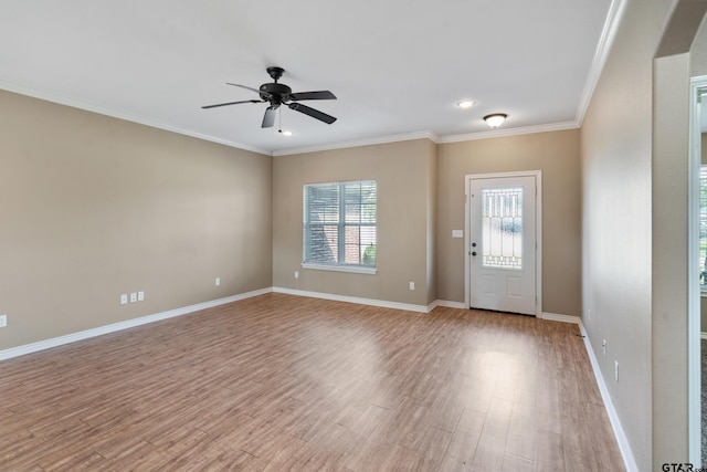 entryway with ornamental molding, ceiling fan, and light hardwood / wood-style floors