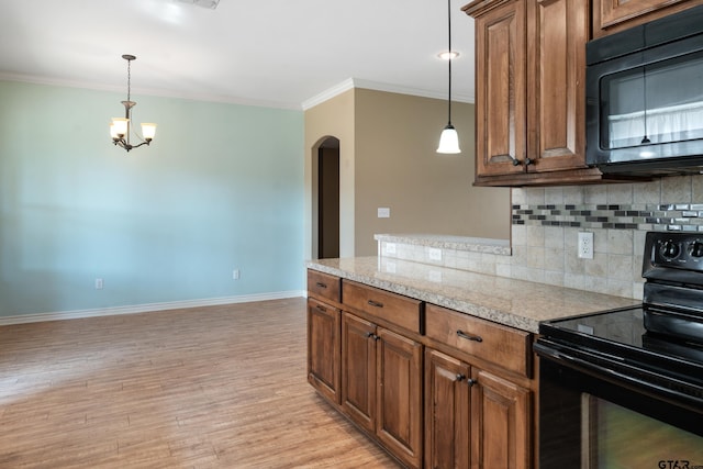 kitchen with black appliances, tasteful backsplash, hanging light fixtures, light hardwood / wood-style flooring, and crown molding