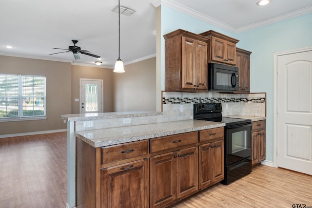 kitchen with black appliances, ornamental molding, backsplash, light hardwood / wood-style floors, and kitchen peninsula