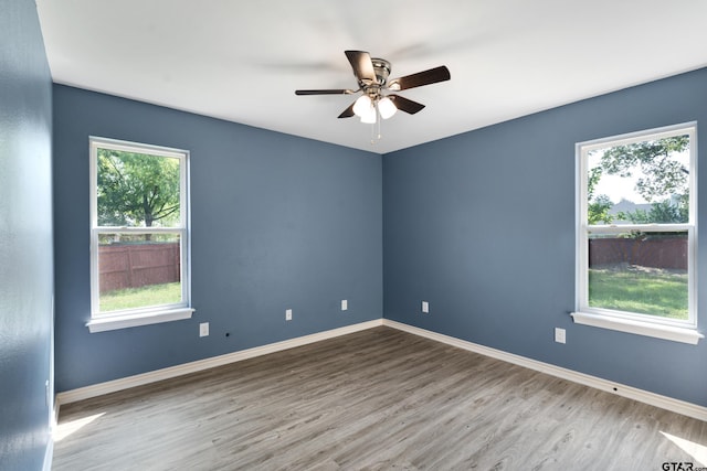 106 Bristol Cir, Chandler, TX 75758 - unfurnished room featuring wood finished floors, healthy amount of natural light, and ceiling fan