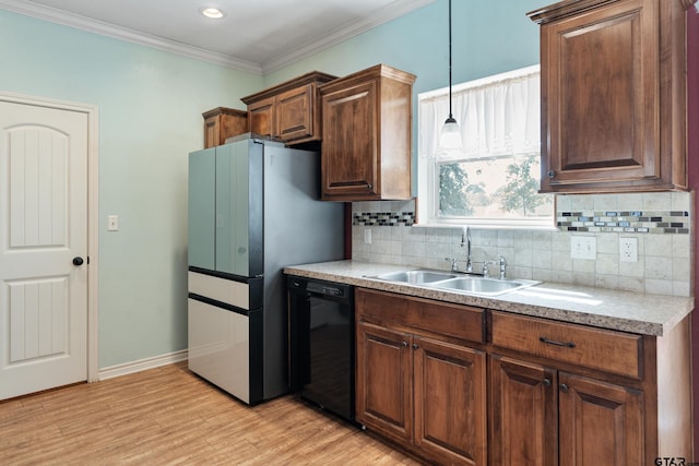 kitchen featuring sink, ornamental molding, light wood-type flooring, decorative backsplash, and black dishwasher