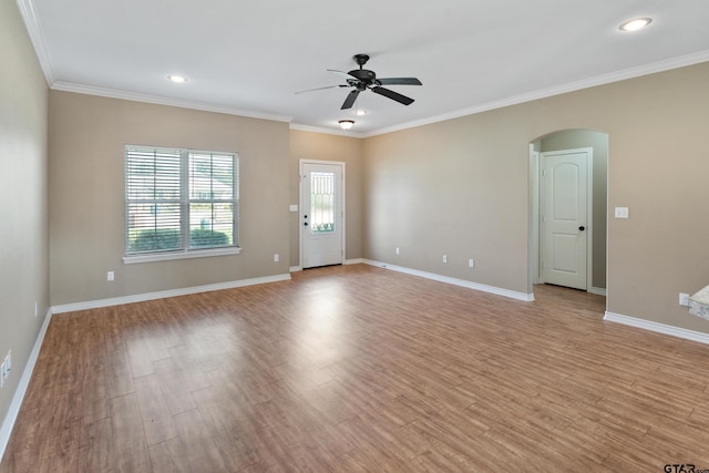 spare room with ceiling fan, light hardwood / wood-style flooring, and crown molding