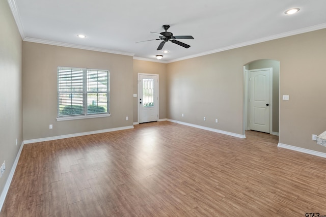 106 Bristol Cir, Chandler, TX 75758 - empty room featuring a ceiling fan, light wood-style floors, arched walkways, ornamental molding, and recessed lighting