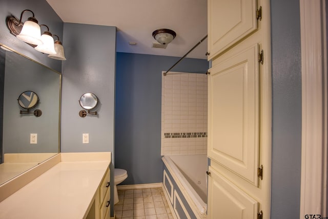 full bathroom with tile patterned floors, tiled shower / bath, vanity, and toilet