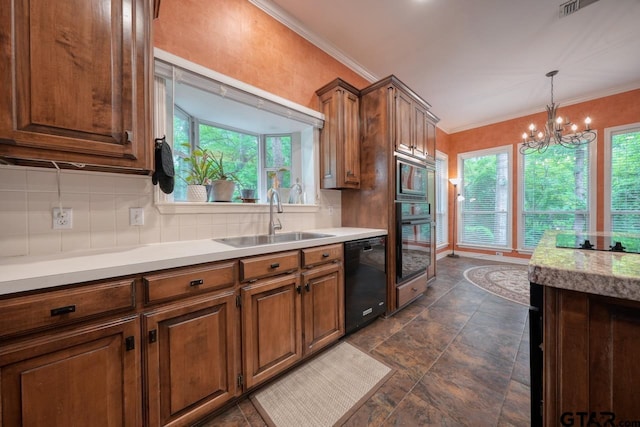3606 Brookview Ct, Tyler, TX 75707 - kitchen featuring black appliances, a chandelier, light countertops, tasteful backsplash, and dark stone finish floors