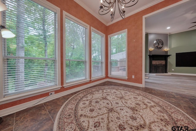 3606 Brookview Ct, Tyler, TX 75707 - dining room with stone tile flooring, a chandelier, healthy amount of natural light, crown molding, and a fireplace