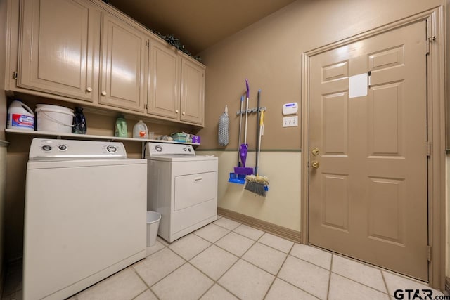 3606 Brookview Ct, Tyler, TX 75707 - washroom with cabinet space, washer and dryer, and light tile patterned floors