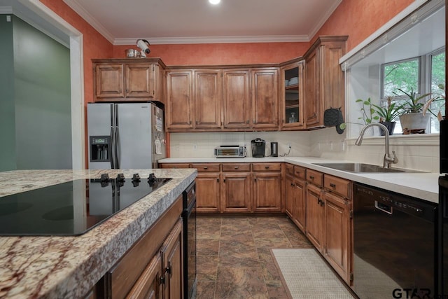 3606 Brookview Ct, Tyler, TX 75707 - kitchen featuring black appliances, stone finish floors, tasteful backsplash, light countertops, and crown molding