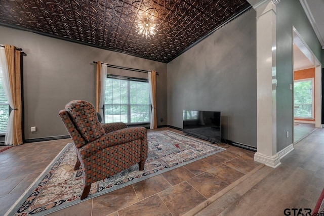 3606 Brookview Ct, Tyler, TX 75707 - sitting room featuring plenty of natural light, an ornate ceiling, stone tile floors, ornamental molding, and ornate columns