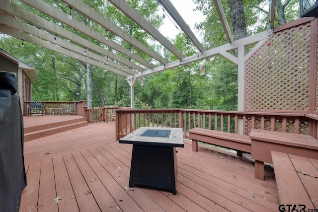 3606 Brookview Ct, Tyler, TX 75707 - wooden deck with a fire pit and a pergola