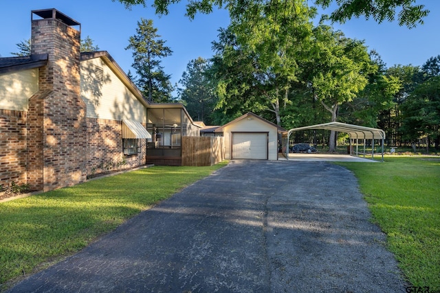 exterior space with a carport, a yard, an outdoor structure, and a garage