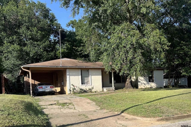 2207 Belvedere Blvd, Tyler, TX 75702 - view of front facade with concrete driveway, a front yard, and an attached carport