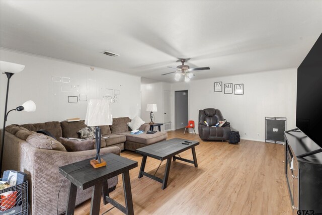 living room with ceiling fan and light hardwood / wood-style floors